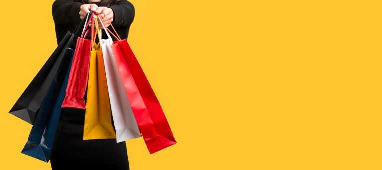 woman-holding-various-shopping-bags-copy-space_optimized.jpg